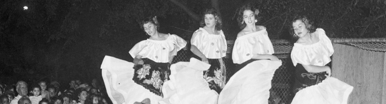 women dancing at a community celebration