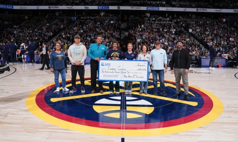 Dawn Zoni (far left) represented Auraria Library among several Denver Metro Area organizations awarded Kroenke Sports Charities grants at Ball Arena’s center court on Jan. 10, 2025. (Credit: Garrett Ellwood Photography)