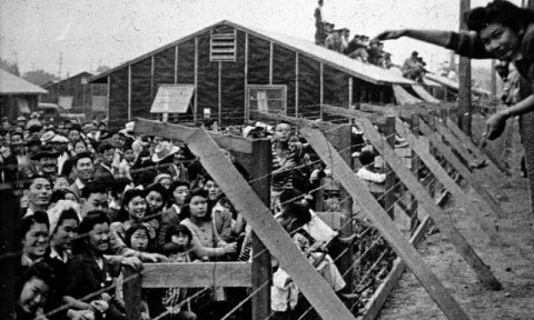 Japanese-American citizens corralled together in an internment camp