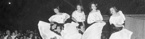 women dancing at a community celebration