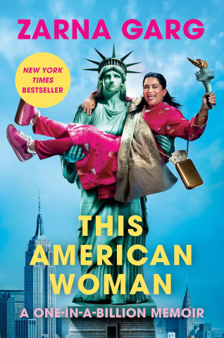 Cover of "This American Woman" by Zarna Garg. The Statue of Liberty holds a joyful woman in pink, set against a New York skyline, conveying humor and empowerment.
