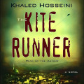 Audiobook cover for Khaled Hosseini’s *The Kite Runner*, with bold red lettering against a hazy green sky above a dark, glowing cityscape; somber and suspenseful.