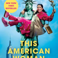 Cover of "This American Woman" by Zarna Garg. The Statue of Liberty holds a joyful woman in pink, set against a New York skyline, conveying humor and empowerment.